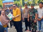 Pj Bupati Parimo Serahkan Cadangan Beras Pemerintah Tahap Pertama