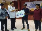Miliaran Rupiah Digelontorkan Bagi 5.458 Penerima Jamsostek Pekerja Rentan Desa di Parimo